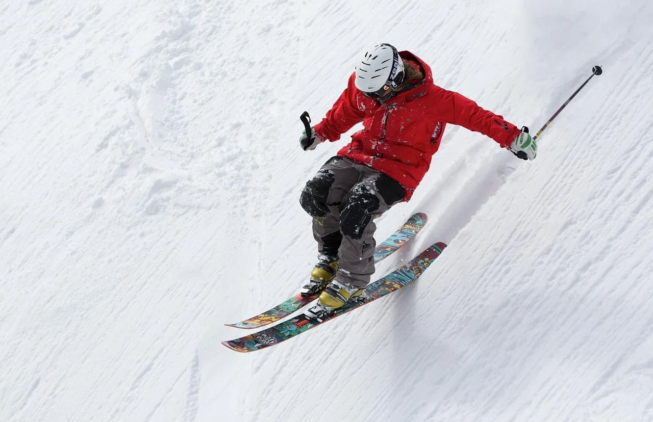 Skier on a snowy mountain slope, a winter trip with a direct flight from Cyprus