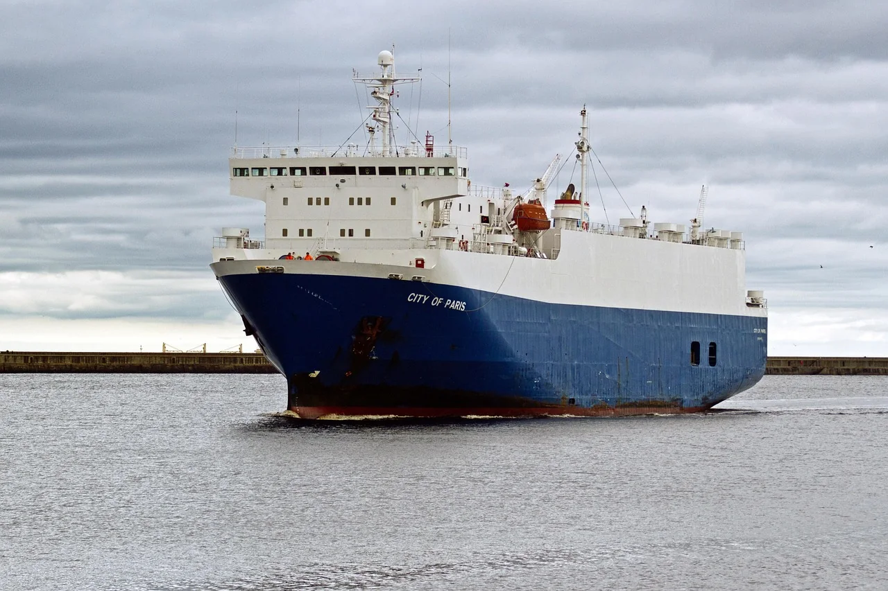 Cars being loaded onto a roll-on/roll-off ship at a port