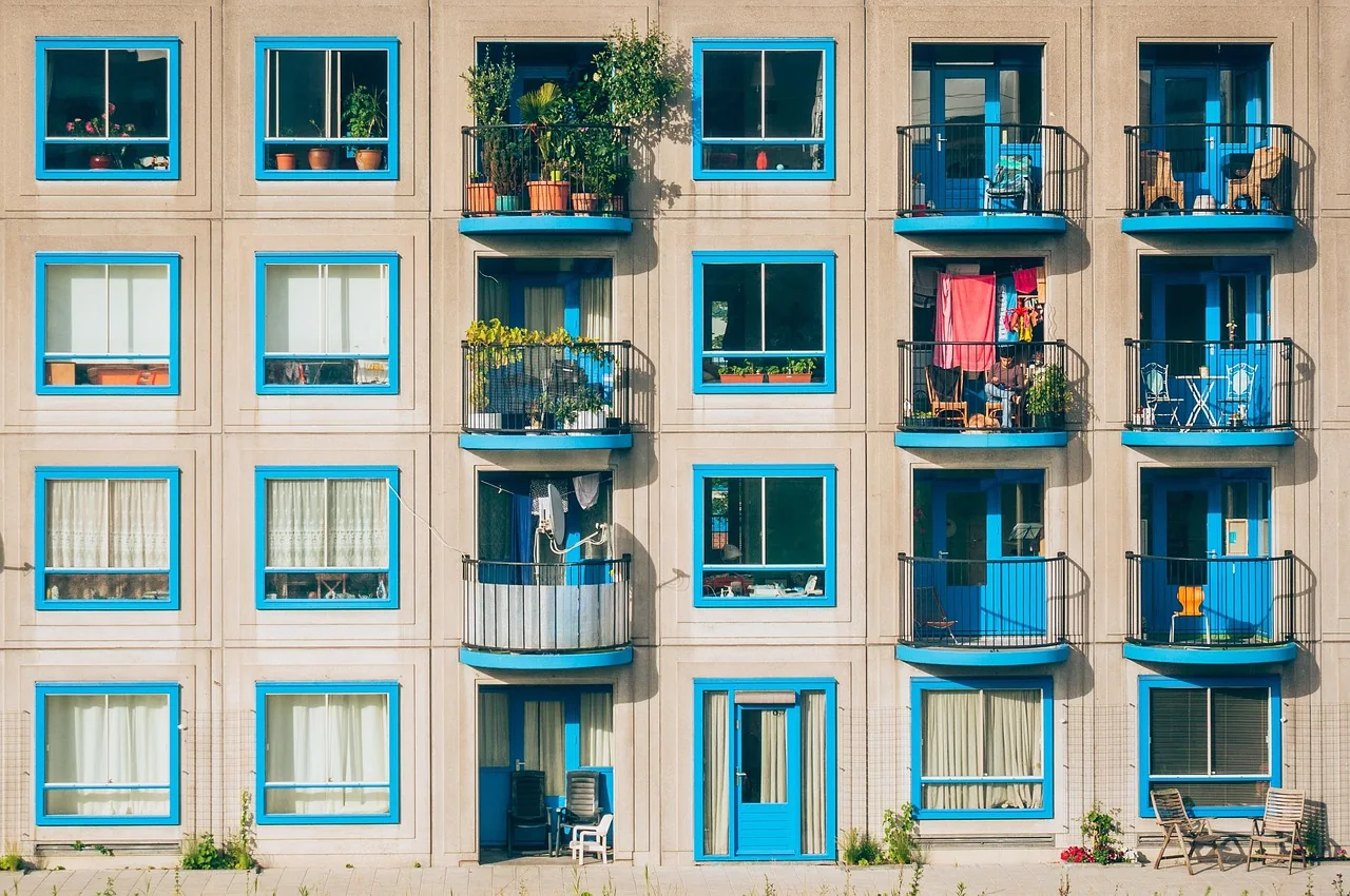 Apartment building with balconies, where owners share the costs of the common areas