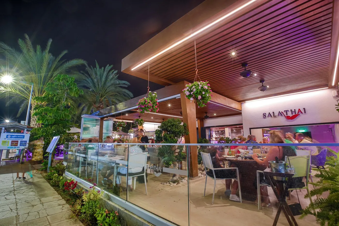 Covered terrace of Sala Thai restaurant in Coral Bay, Paphos, at night