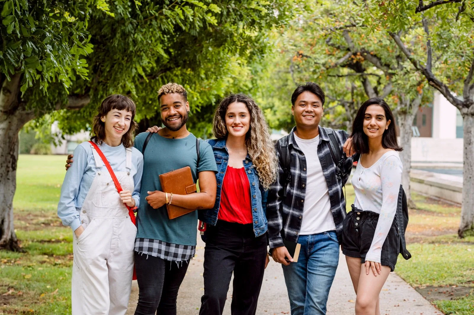 Diverse group of university students on campus in summer