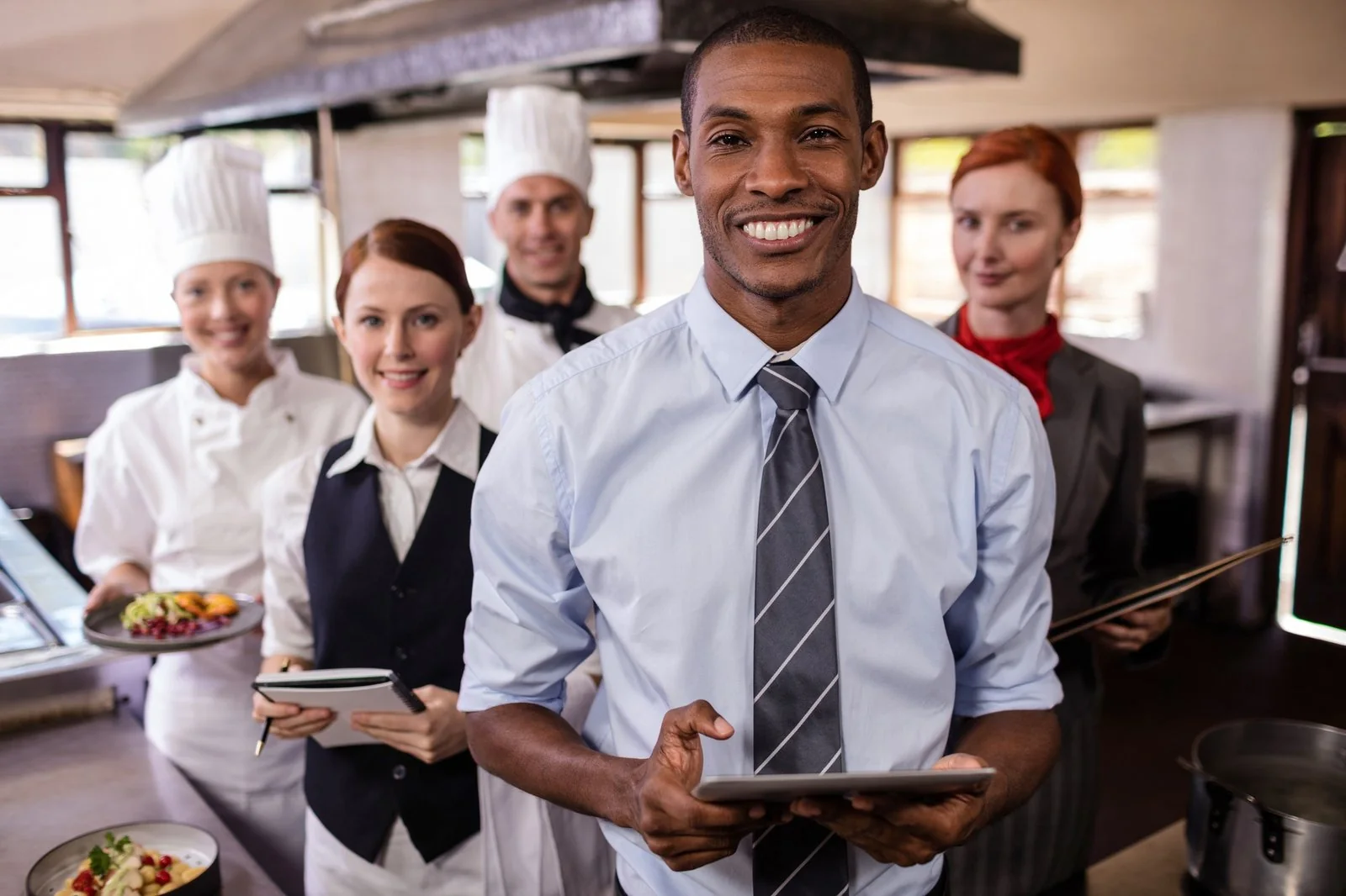 Hotel staff working in a kitchen
