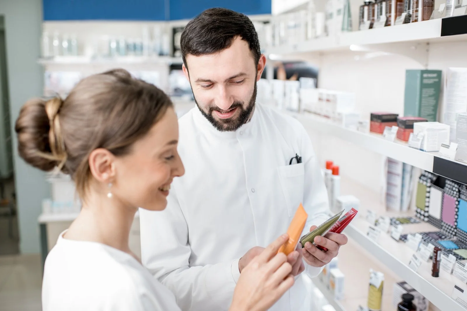 Pharmacist serving a client in a pharmacy
