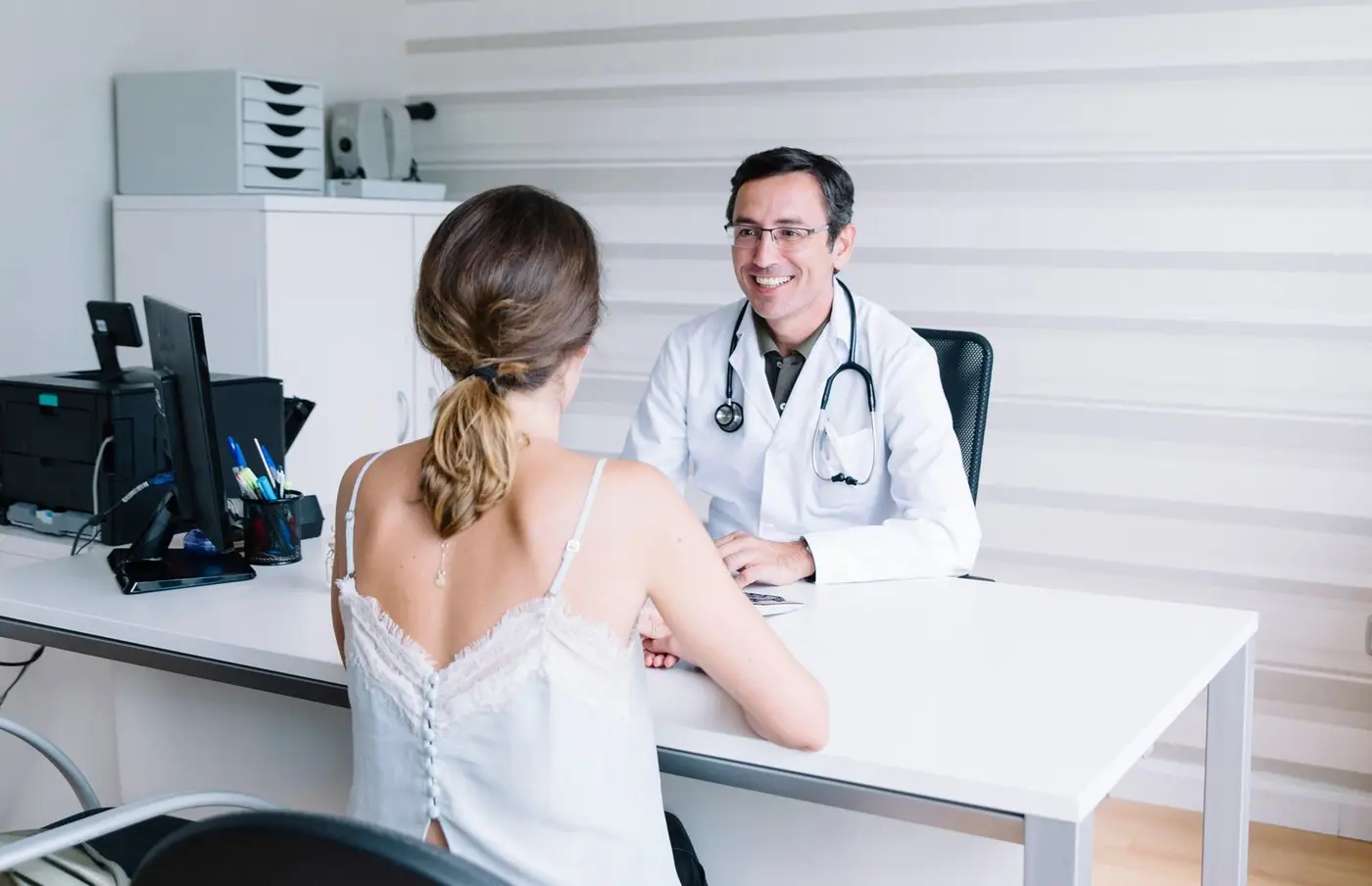 Male doctor with a female patient