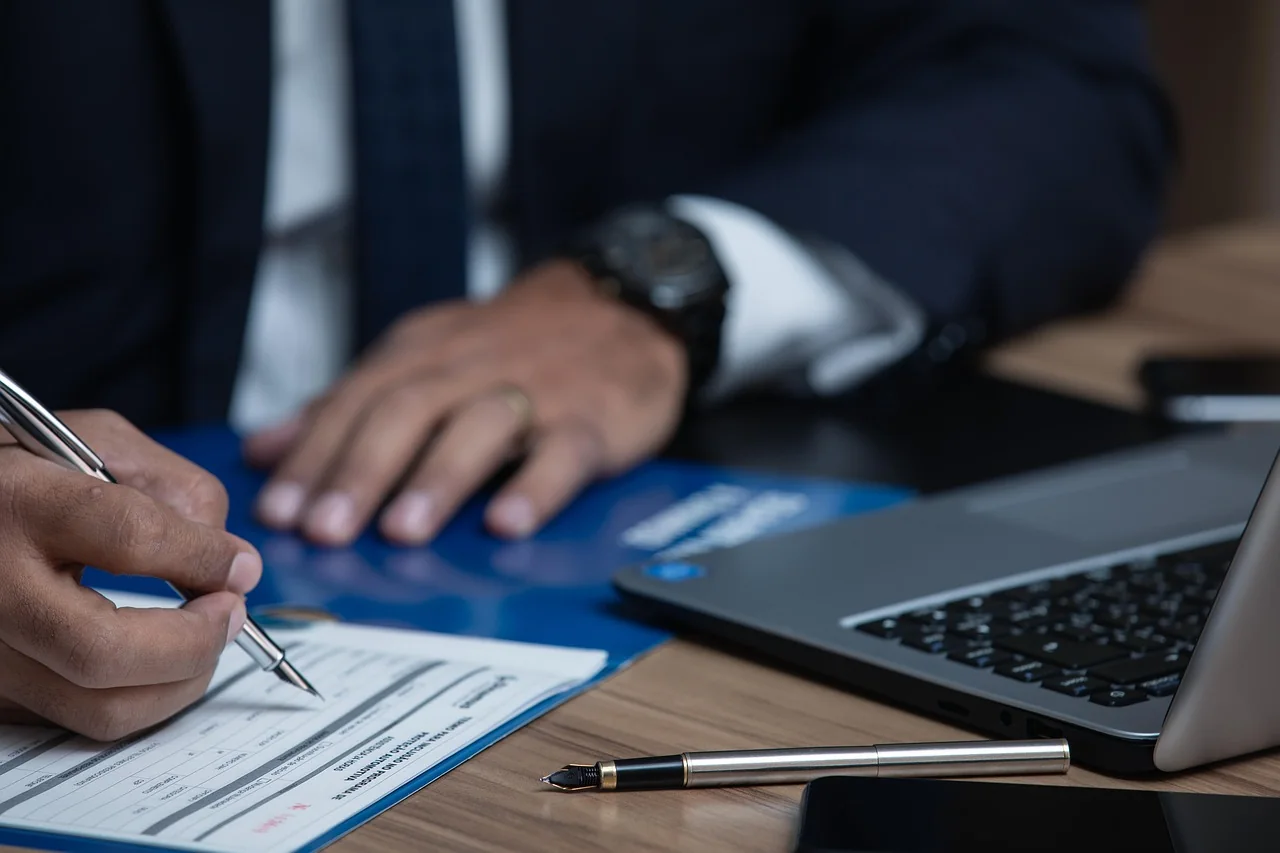 Business owners signing company registration documents