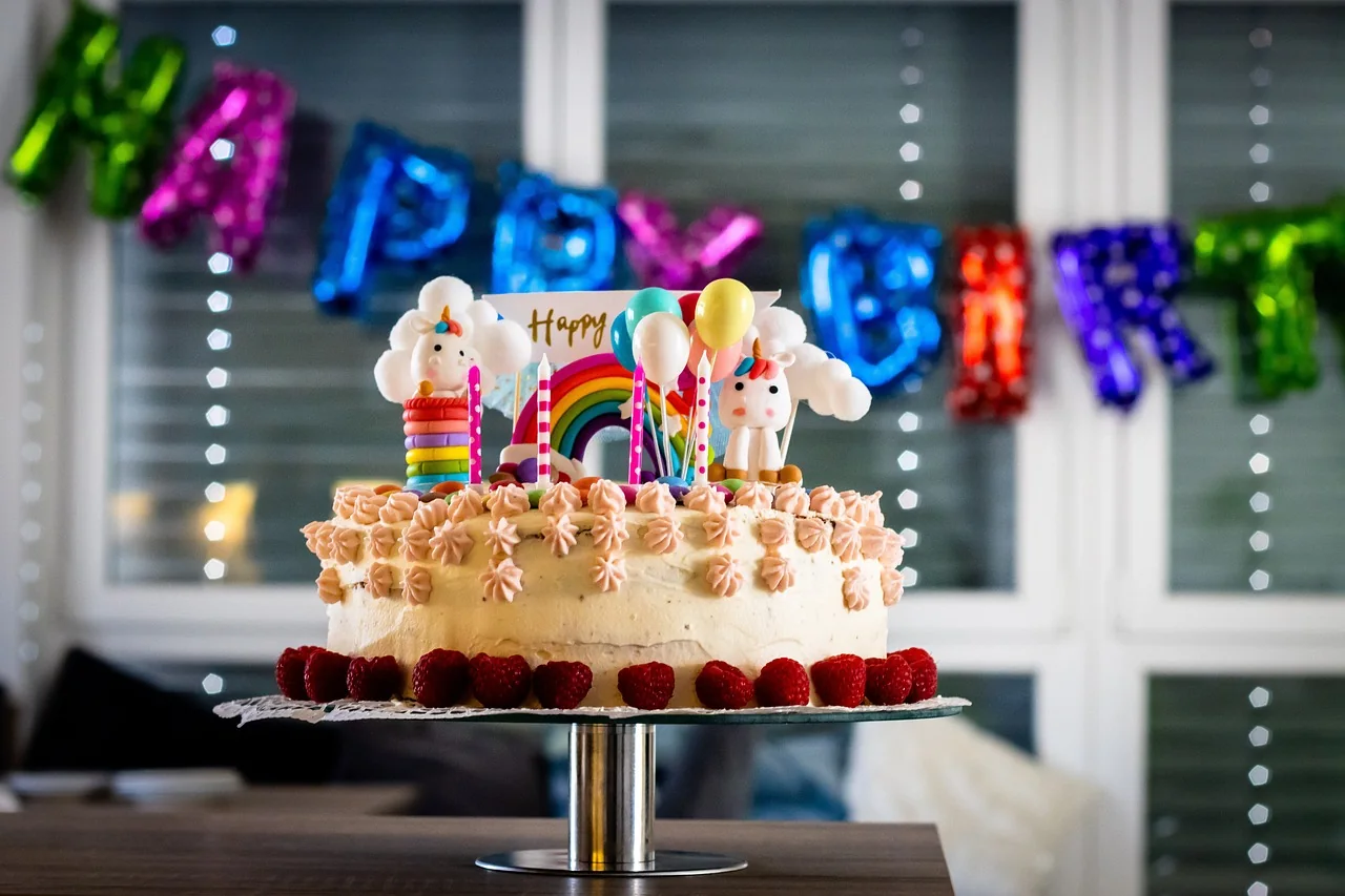 Children at a birthday party with a cake