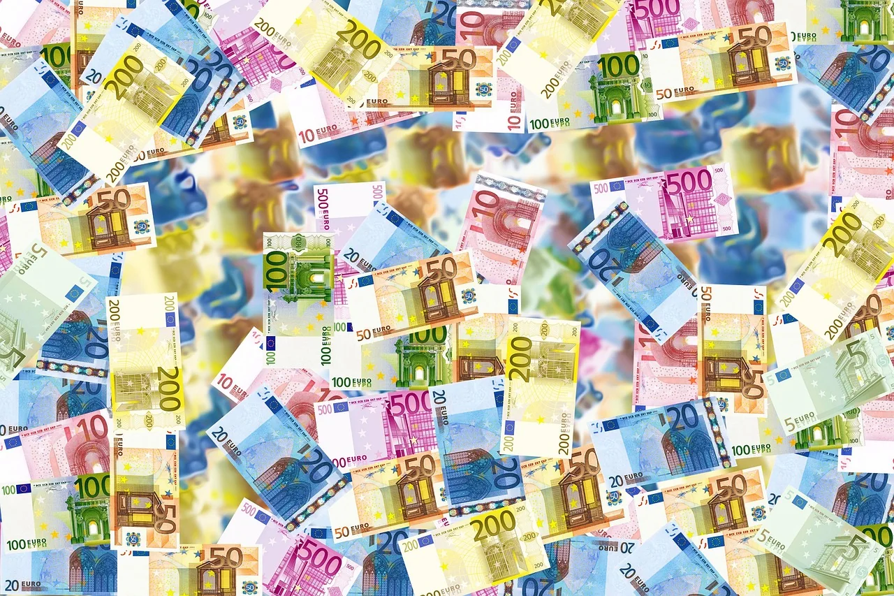 Euro banknotes and a bank card on a desk, ready for a transfer from the UAE to Cyprus