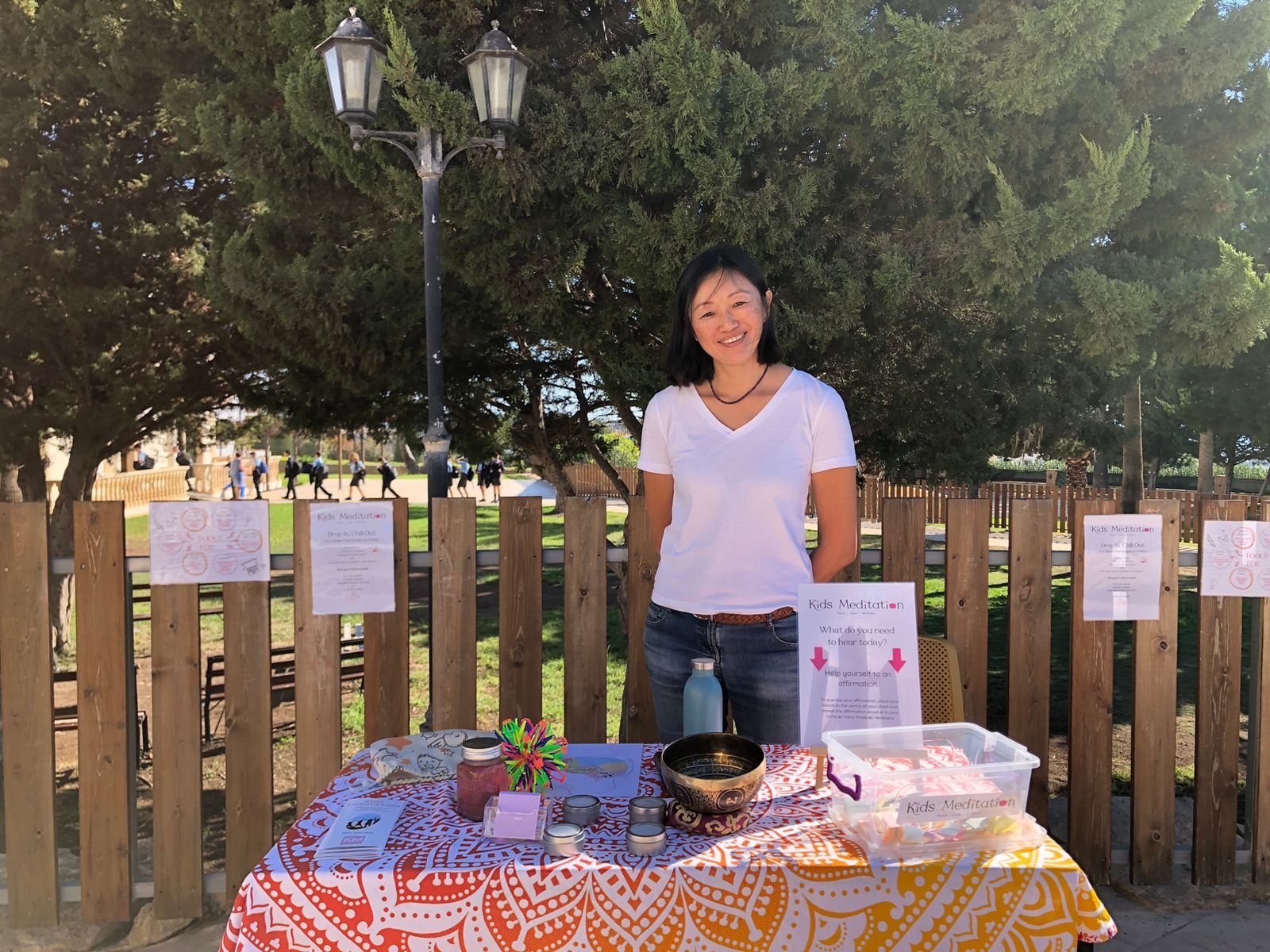 Judy Lam at her Eric the Penguin stall at an outdoor Christmas fair