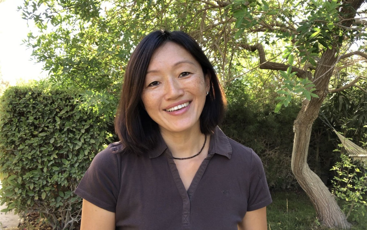 Portrait of Judy Lam smiling in a garden in the Paphos area