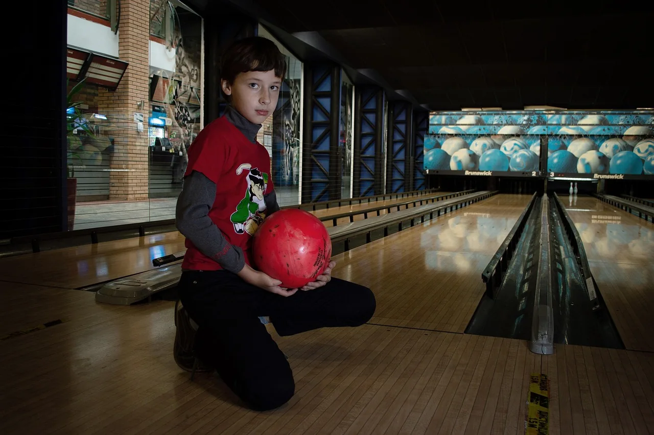 Children bowling at an indoor bowling alley
