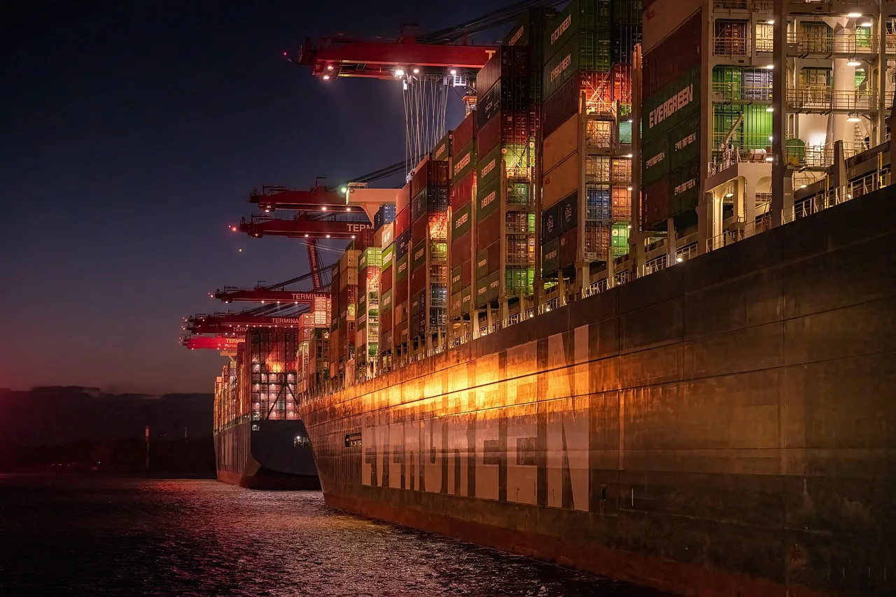 Container ship and gantry cranes at a container port, the sea route a household move from Dubai to Cyprus takes