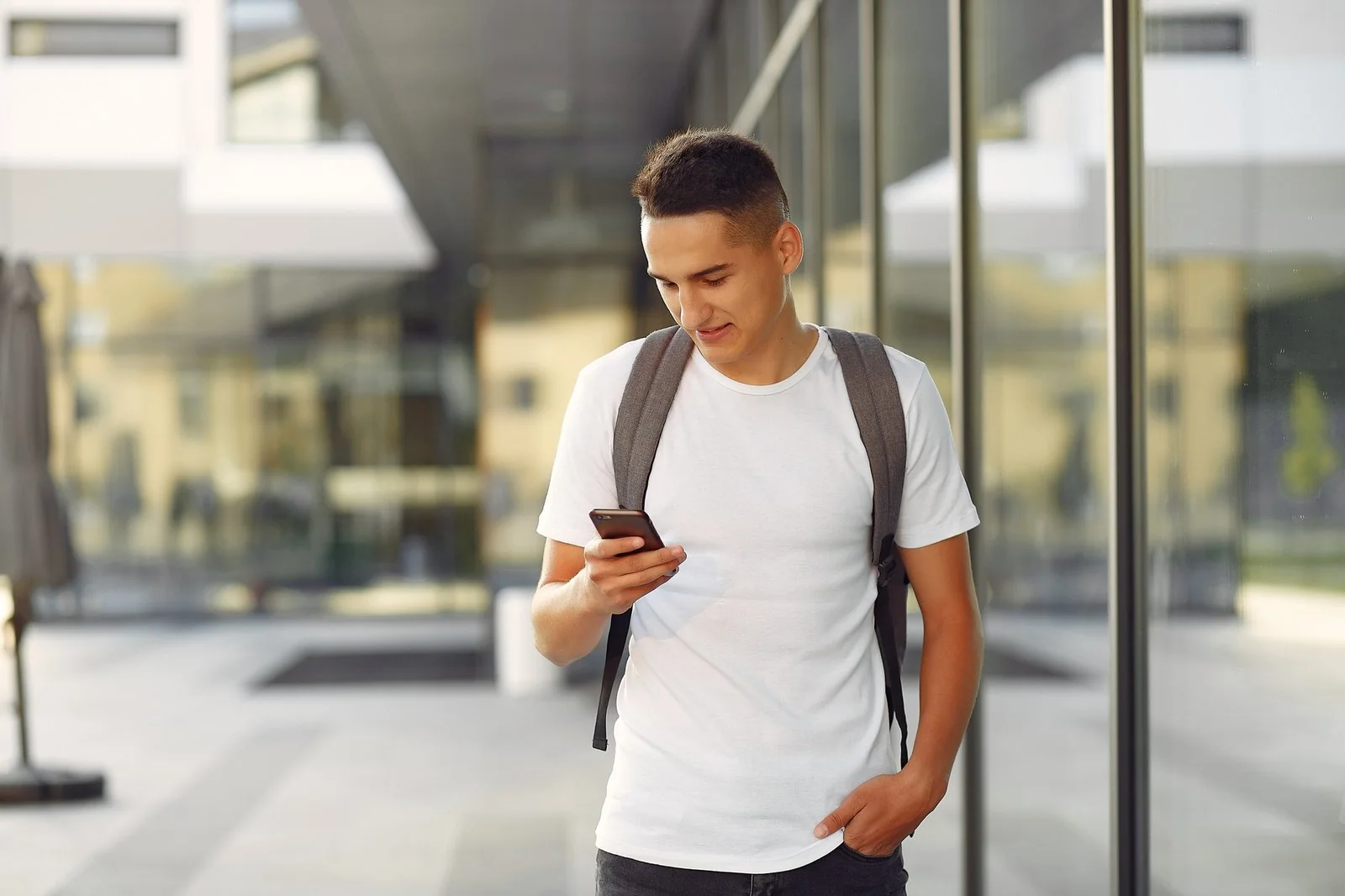 Student on the Cyprus International University campus using a phone