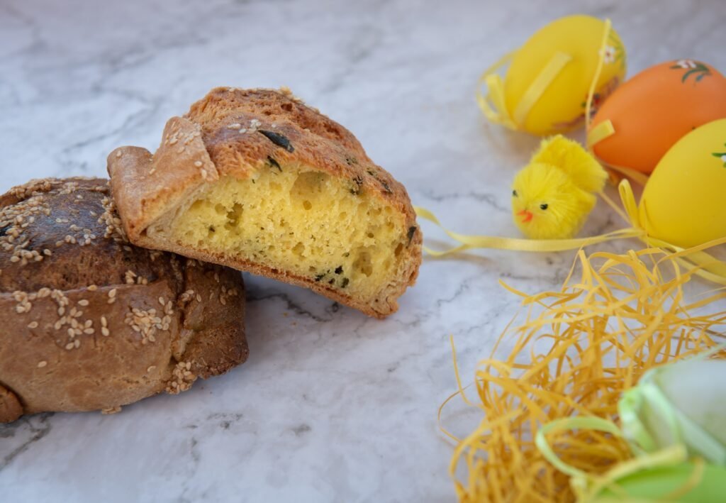 Traditional Cypriot Easter cheese pastries (flaounes) on a table